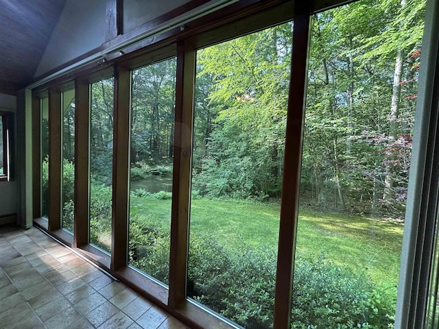 12 Juniper Ridge Rd, Exeter, NH 03833 - doorway featuring stone tile flooring, vaulted ceiling, and a wooded view