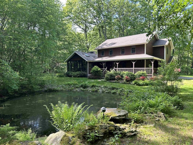 12 Juniper Ridge Rd, Exeter, NH 03833 - rear view of house with a yard and covered porch