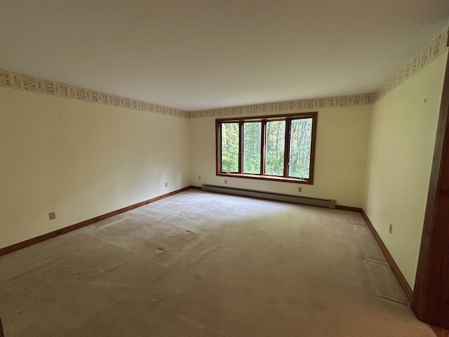 12 Juniper Ridge Rd, Exeter, NH 03833 - empty room featuring baseboard heating and light colored carpet