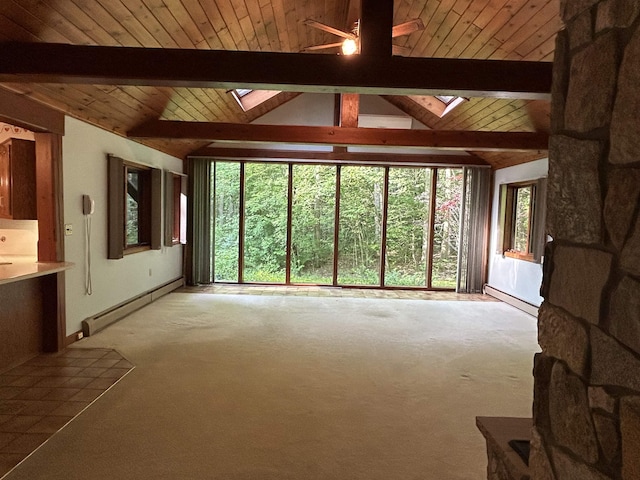 12 Juniper Ridge Rd, Exeter, NH 03833 - unfurnished living room with a skylight, ceiling fan, a baseboard heating unit, light carpet, and plenty of natural light