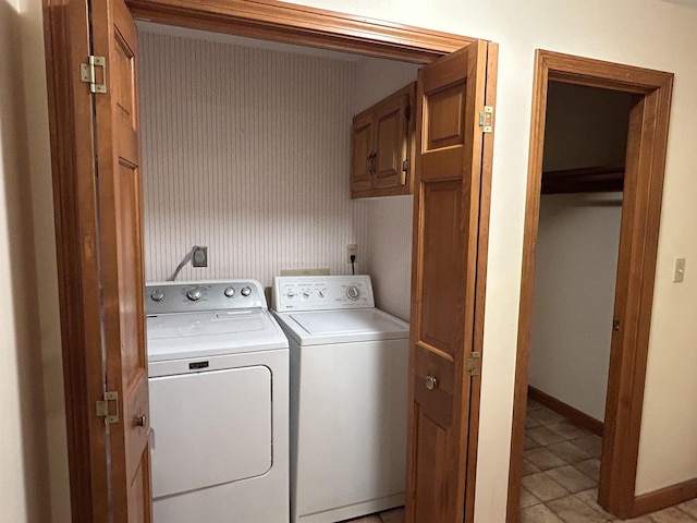 12 Juniper Ridge Rd, Exeter, NH 03833 - laundry area featuring washer and clothes dryer, cabinet space, and light tile patterned floors