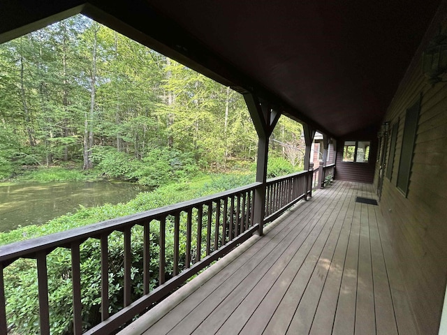 12 Juniper Ridge Rd, Exeter, NH 03833 - wooden terrace with a water view and a forest view