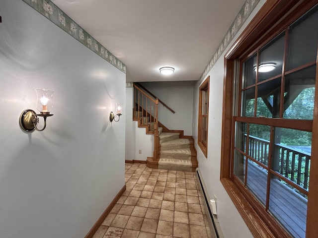 12 Juniper Ridge Rd, Exeter, NH 03833 - hallway with stairway, light stone finish floors, and a baseboard heating unit