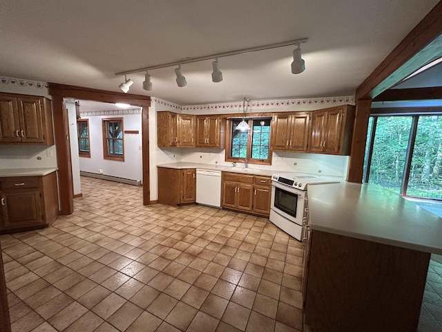 12 Juniper Ridge Rd, Exeter, NH 03833 - kitchen featuring white appliances, track lighting, a baseboard radiator, and light countertops