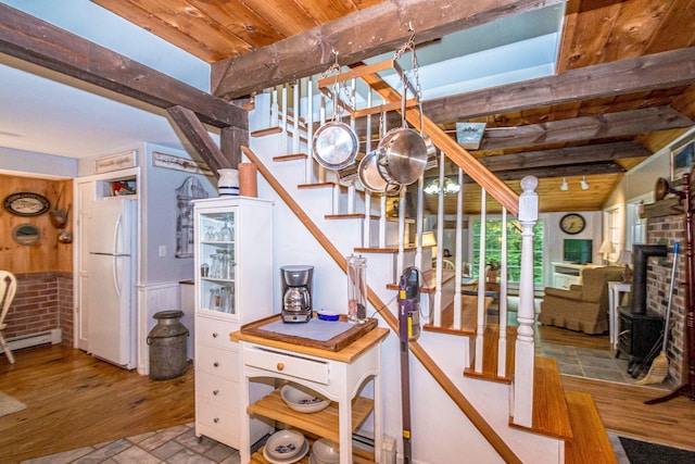 435 Rolling Ridge Rd, Bartlett, NH 03812 - staircase featuring a wooden ceiling with exposed beams, a wainscoted wall, and wood finished floors
