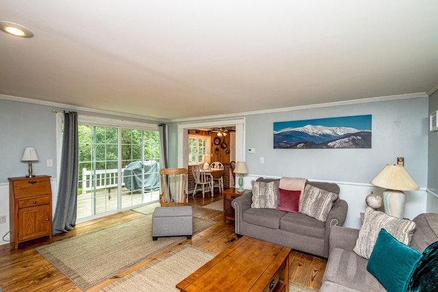 435 Rolling Ridge Rd, Bartlett, NH 03812 - living area with crown molding, wood finished floors, and healthy amount of natural light
