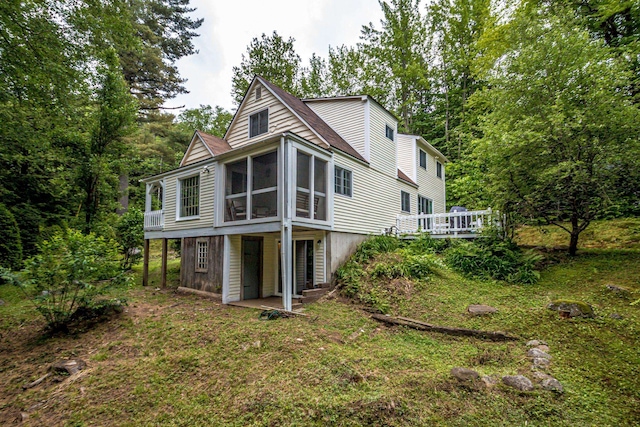 435 Rolling Ridge Rd, Bartlett, NH 03812 - rear view of property with a sunroom and a deck