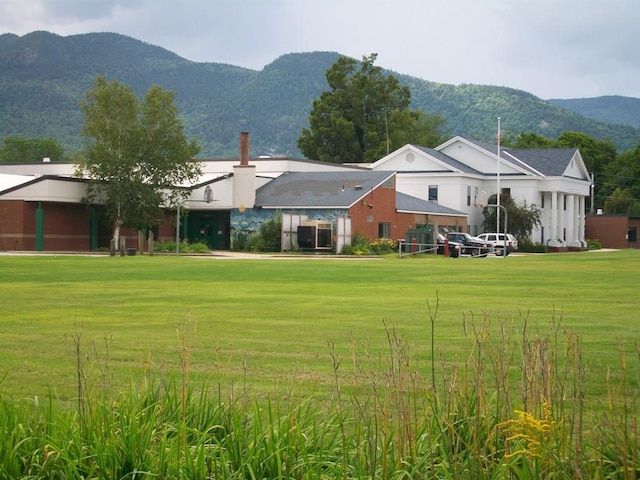 435 Rolling Ridge Rd, Bartlett, NH 03812 - rear view of house featuring a mountain view and a yard