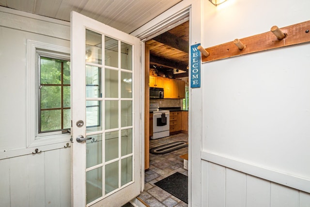 435 Rolling Ridge Rd, Bartlett, NH 03812 - doorway featuring french doors, wood walls, and stone finish flooring
