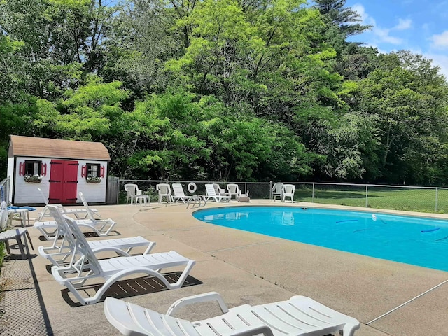 435 Rolling Ridge Rd, Bartlett, NH 03812 - community pool with a patio area, view of wooded area, and a shed