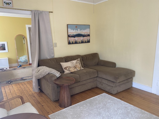 7-9 Elm St, Waterbury, VT 05676 - living area featuring hardwood / wood-style flooring, crown molding, and arched walkways