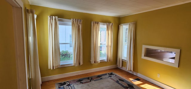 7-9 Elm St, Waterbury, VT 05676 - exercise room featuring wood finished floors and crown molding