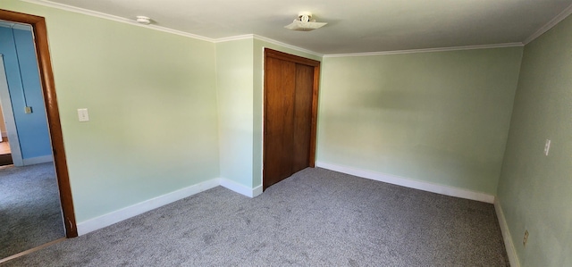 7-9 Elm St, Waterbury, VT 05676 - empty room with carpet, ornamental molding, and a smoke detector