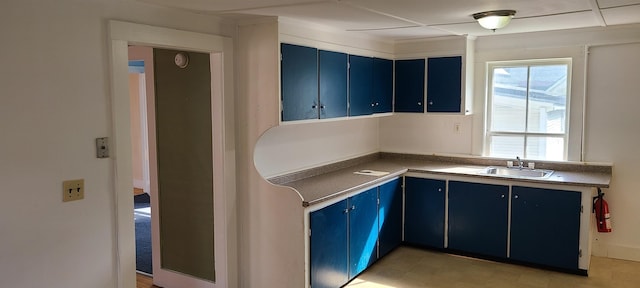 7-9 Elm St, Waterbury, VT 05676 - kitchen featuring blue cabinets and dark countertops