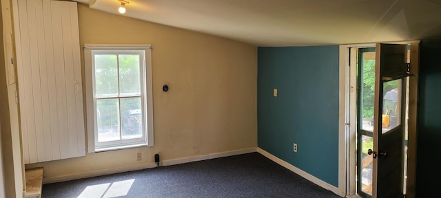 7-9 Elm St, Waterbury, VT 05676 - entrance foyer with dark carpet and vaulted ceiling