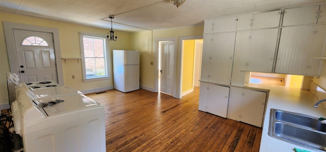 7-9 Elm St, Waterbury, VT 05676 - kitchen with freestanding refrigerator, washer / clothes dryer, light wood-type flooring, and pendant lighting