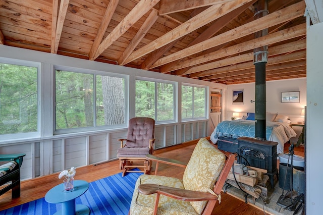 28 Brook Ln, Conway, NH 03818 - bedroom featuring a wood stove, wooden ceiling, and wood finished floors