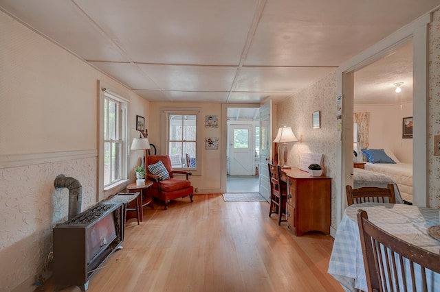 28 Brook Ln, Conway, NH 03818 - foyer with light wood-style floors and a wood stove