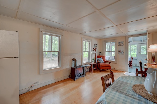 28 Brook Ln, Conway, NH 03818 - dining space featuring a wood stove and light wood-style flooring