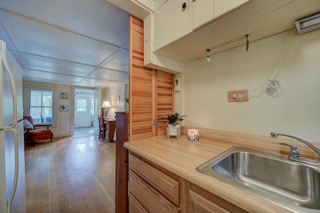 28 Brook Ln, Conway, NH 03818 - kitchen with light countertops, freestanding refrigerator, and wood finished floors