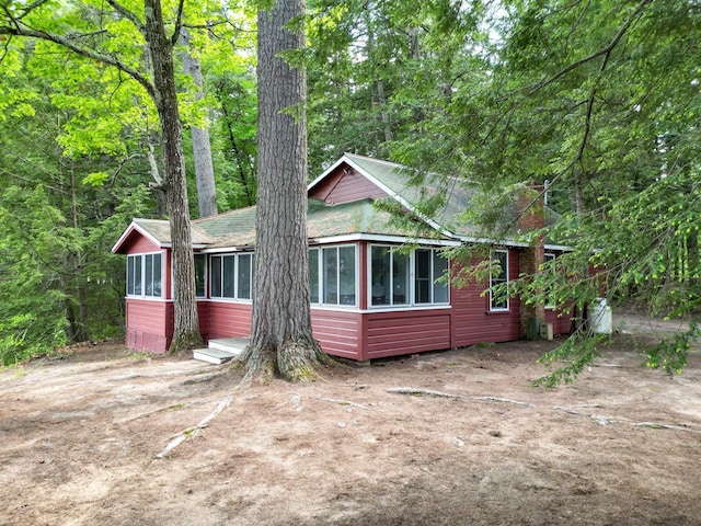 28 Brook Ln, Conway, NH 03818 - view of front of property featuring a sunroom