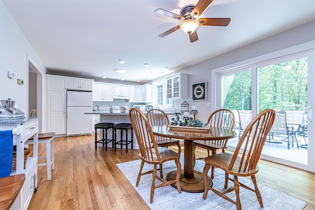 48 Cider Mill Rd, Bedford, NH 03110 - dining room with ceiling fan and light wood-type flooring