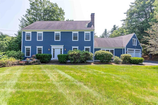 48 Cider Mill Rd, Bedford, NH 03110 - colonial inspired home with a chimney, a front yard, and a garage