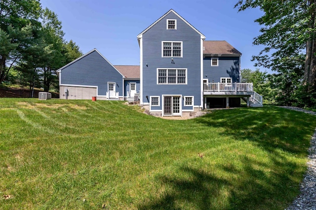 48 Cider Mill Rd, Bedford, NH 03110 - rear view of house with a deck, a yard, and stairs