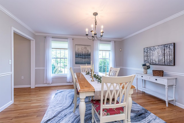 48 Cider Mill Rd, Bedford, NH 03110 - dining space with a chandelier, light wood finished floors, and crown molding