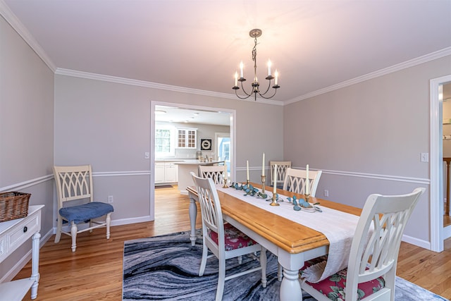 48 Cider Mill Rd, Bedford, NH 03110 - dining room with a chandelier, light wood-style flooring, and ornamental molding