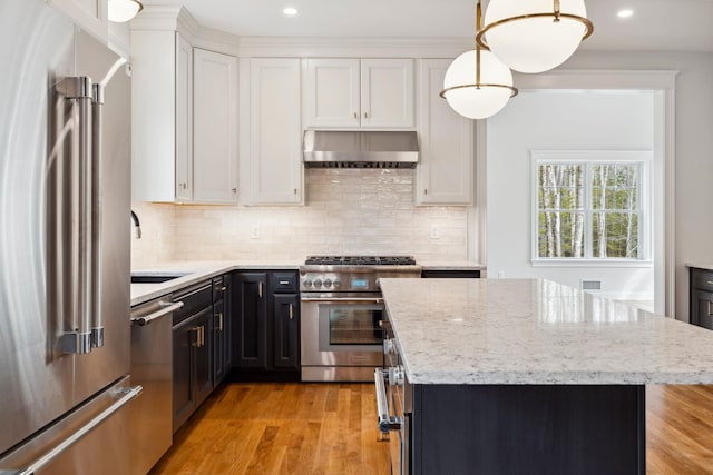 131 Exeter Rd, North Hampton, NH 03862 - kitchen featuring high quality appliances, extractor fan, white cabinets, a kitchen island, and recessed lighting