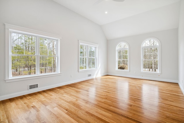 131 Exeter Rd, North Hampton, NH 03862 - empty room with plenty of natural light, wood finished floors, a ceiling fan, and high vaulted ceiling