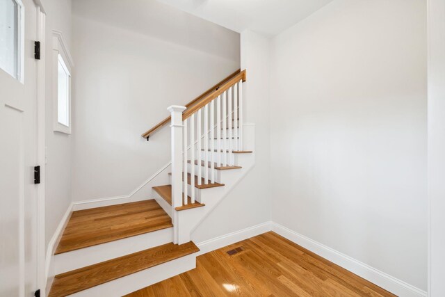 131 Exeter Rd, North Hampton, NH 03862 - stairway with wood finished floors and baseboards