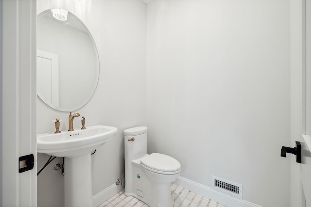 131 Exeter Rd, North Hampton, NH 03862 - half bathroom with toilet and baseboards