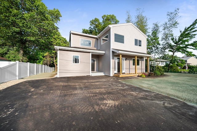 13 Raven St, Nashua, NH 03060 - contemporary home with asphalt driveway and a porch