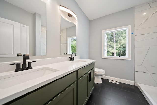 13 Raven St, Nashua, NH 03060 - full bath with double vanity, healthy amount of natural light, tile patterned flooring, and a tile shower