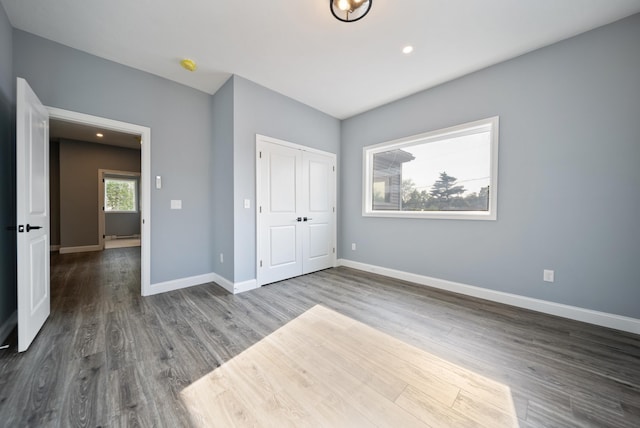 13 Raven St, Nashua, NH 03060 - unfurnished bedroom featuring wood finished floors, recessed lighting, and a closet