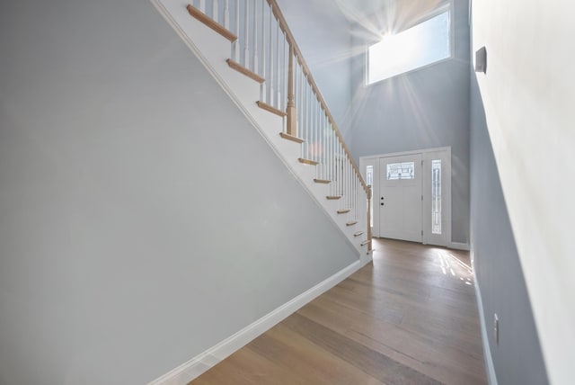 13 Raven St, Nashua, NH 03060 - foyer with stairs, wood finished floors, and a towering ceiling