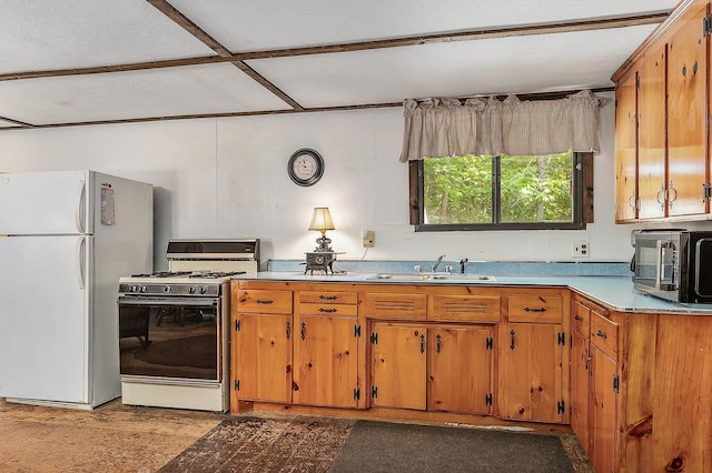 11 Dearborn Rd, Wakefield, NH 03830 - kitchen featuring range with gas stovetop, freestanding refrigerator, black microwave, and brown cabinetry