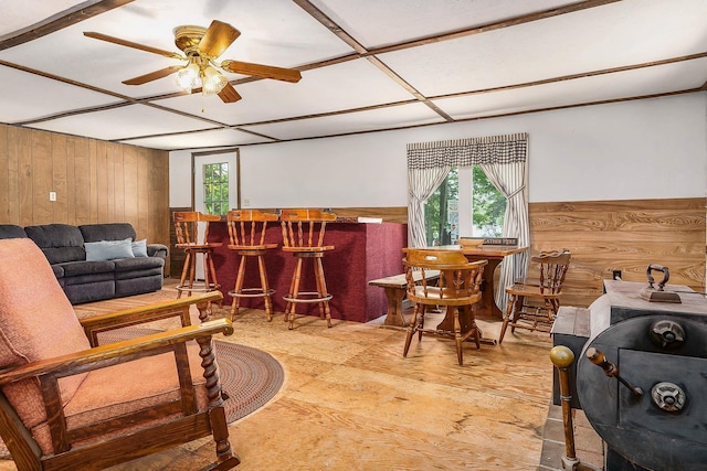 11 Dearborn Rd, Wakefield, NH 03830 - living area with a dry bar, healthy amount of natural light, wood walls, and ceiling fan