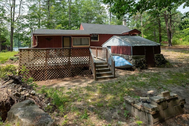 11 Dearborn Rd, Wakefield, NH 03830 - rear view of property featuring a shingled roof and a deck