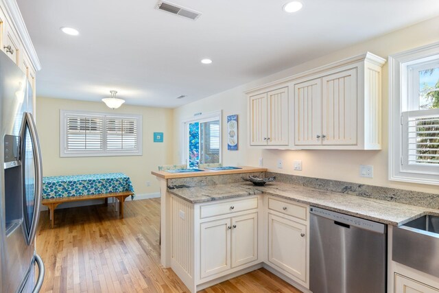 5 Fellows Ave, Hampton, NH 03842 - kitchen featuring stainless steel appliances, a peninsula, plenty of natural light, light wood finished floors, and recessed lighting