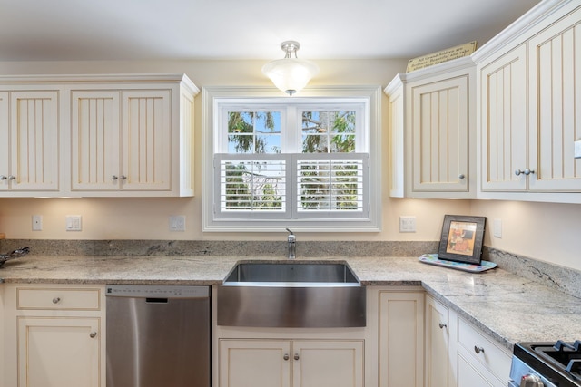 5 Fellows Ave, Hampton, NH 03842 - kitchen featuring stainless steel dishwasher, range, light stone counters, and cream cabinets