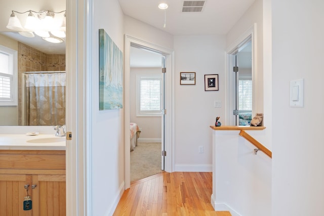 5 Fellows Ave, Hampton, NH 03842 - hallway featuring a sink and light wood-type flooring