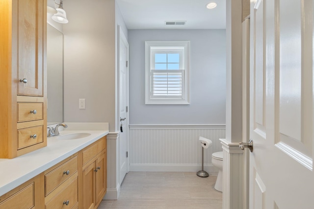 5 Fellows Ave, Hampton, NH 03842 - bathroom with vanity, wood finished floors, and a wainscoted wall