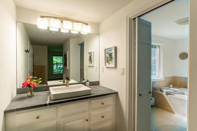137 Wildes District Rd, Kennebunkport, ME 04046 - bathroom featuring a garden tub, vanity, and tile patterned floors
