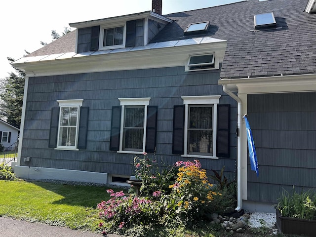 104 Middle St, Lancaster, NH 03584 - view of side of home featuring a chimney and roof with shingles