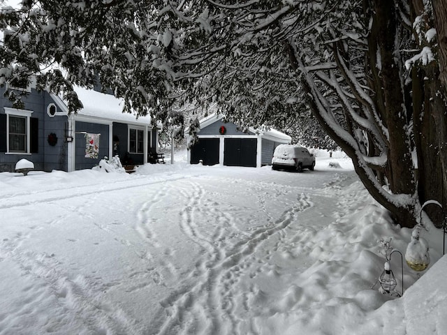 104 Middle St, Lancaster, NH 03584 - view of snow covered exterior with an outbuilding