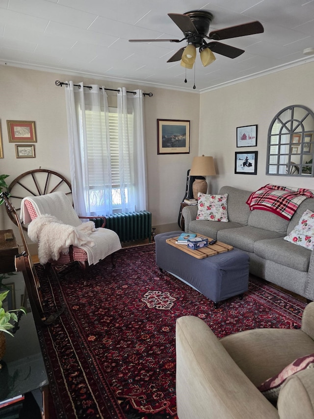 104 Middle St, Lancaster, NH 03584 - carpeted living room featuring ornamental molding, radiator, and a ceiling fan