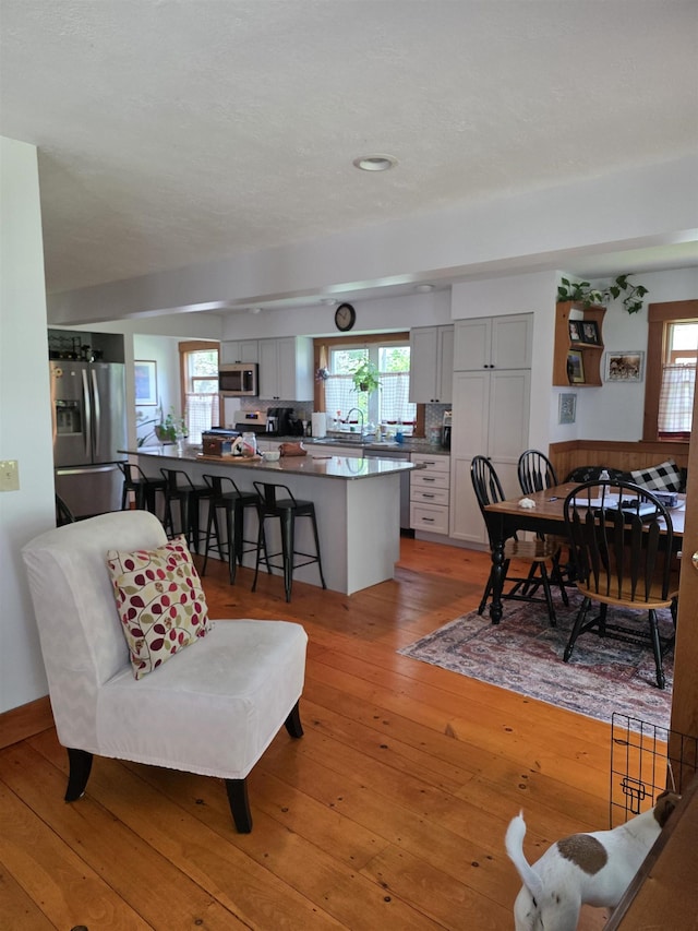 104 Middle St, Lancaster, NH 03584 - living room with plenty of natural light, light wood-style floors, and recessed lighting